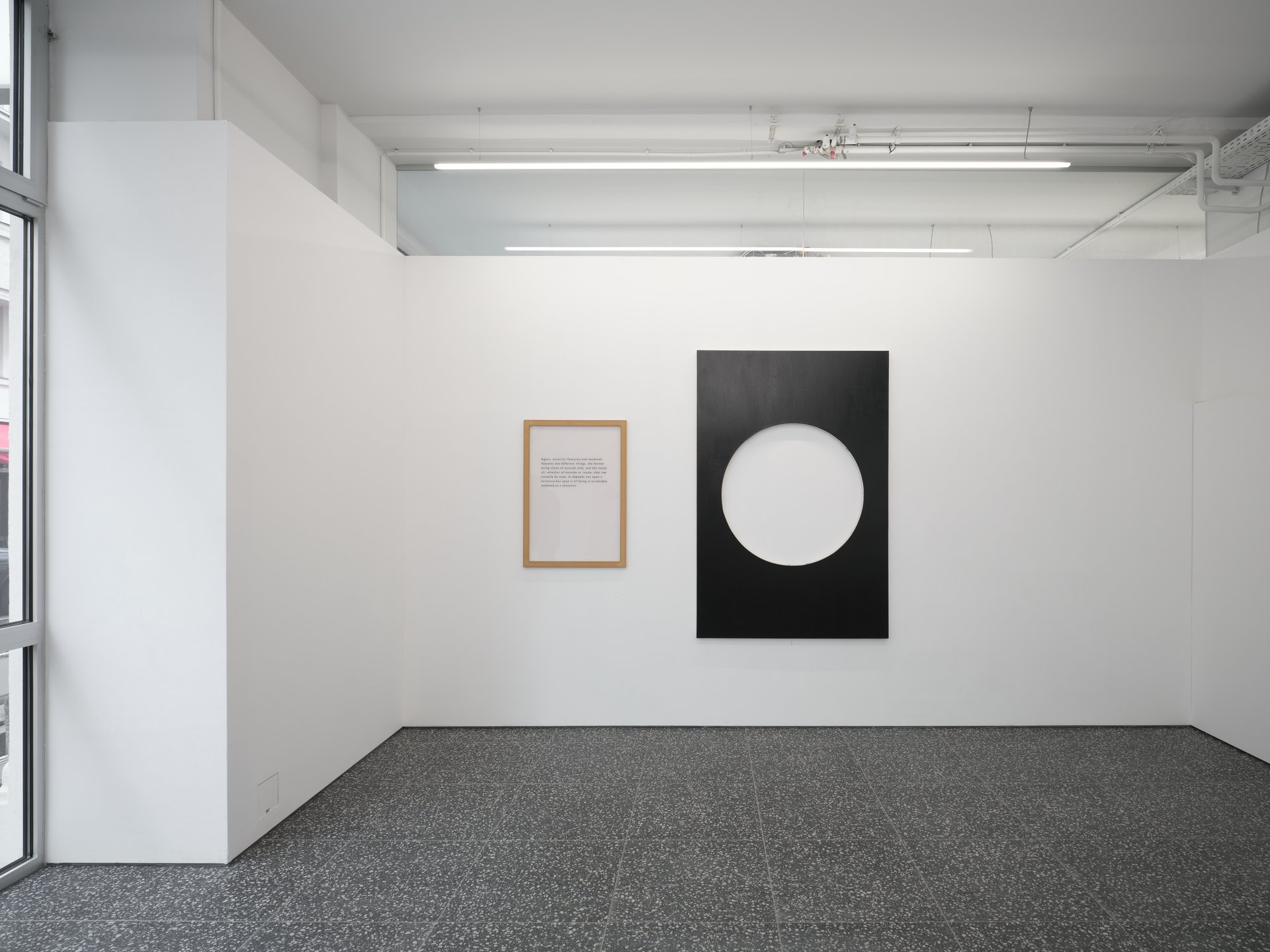 Installation view, Support, Curated By, Gaylen Gerber, Layr, Vienna, 2024Left to right: Hirsch Perlman, Accidence (5),1989, b/w print mounted to Plexiglas, MDF frame, 93.9 x 66 x 4 cm (37 x 26 x 1 ½ inches), Stephen Parrino, Freud in Flop, 1987, lacquer on cotton, 180 x 120 cm (70 ¾ x 47 ¼ inches); Heimo Zobernig, ohne Titel, 1992, 2024, dispersion, pressboard, wood, 180 x 2080 x 6 cm (70 7/8 x 818 7/8 x 2 3/8 inches)