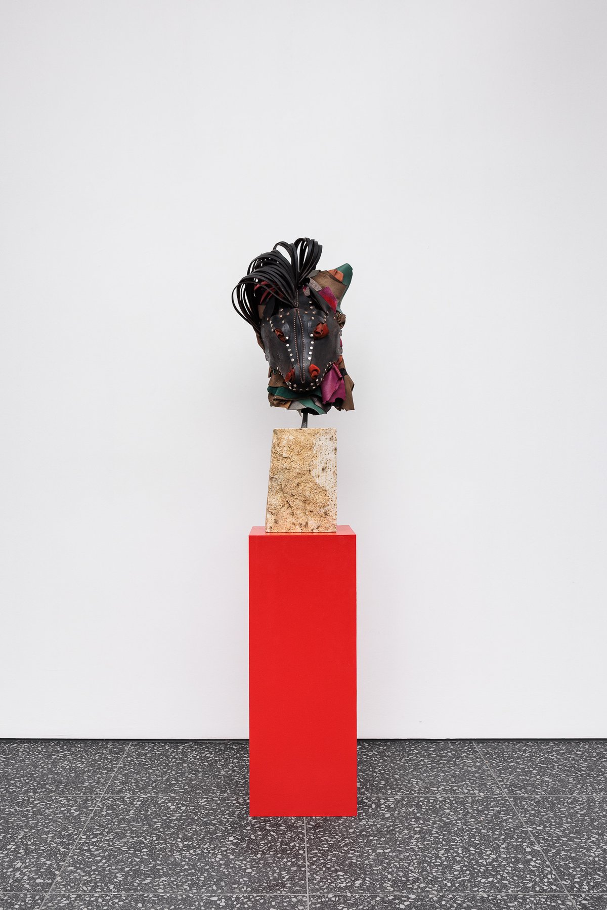Lena HenkeMemory of a Young Sculpture XO, 2024Soldered and boiled leather, pigment and steel mounted on Austrian granite, on wooden pedestal30 x 30 x 167 cm (installed dimensions)30 x 30 x 79 cm (plinth), 30 x 20 x 75 cm (stone), 35 x 30 x 58 cm (mask)
