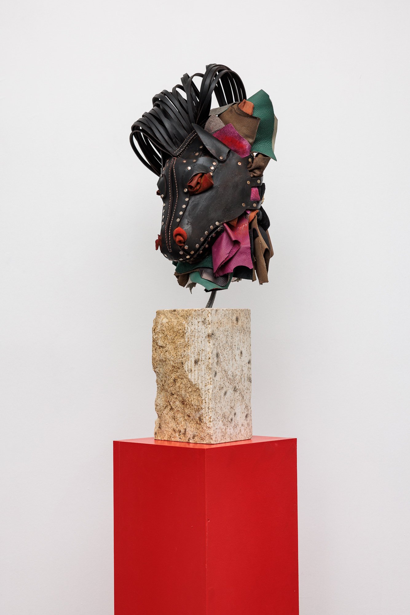 Lena HenkeMemory of a Young Sculpture XO, 2024Soldered and boiled leather, pigment and steel mounted on Austrian granite, on wooden pedestal30 x 30 x 167 cm (installed dimensions)30 x 30 x 79 cm (plinth), 30 x 20 x 75 cm (stone), 35 x 30 x 58 cm (mask)