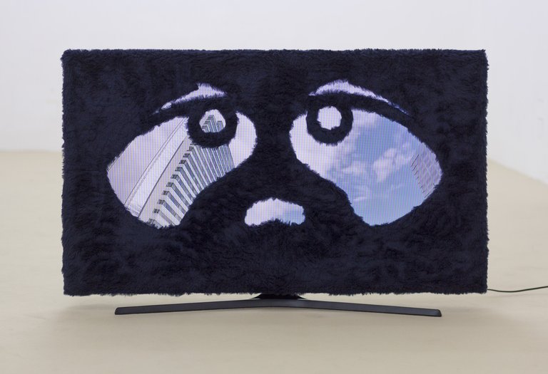 Philipp TimischlUntitled, 2017Cardboard, fake fur, flatscreen, videos00:11:47