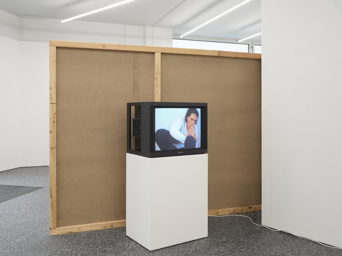 Installation view, Support, Curated By, Gaylen Gerber, Layr, Vienna, 2024Left to right: Heimo Zobernig, ohne Titel, 1992, 2024, dispersion, pressboard, wood, 180 x 2080 x 6 cm (70 7/8 x 818 7/8 x 2 3/8 inches); Jeanne Dunning, The Toe Sucking Video, 1994, video, monitor, dimensions vary with installation