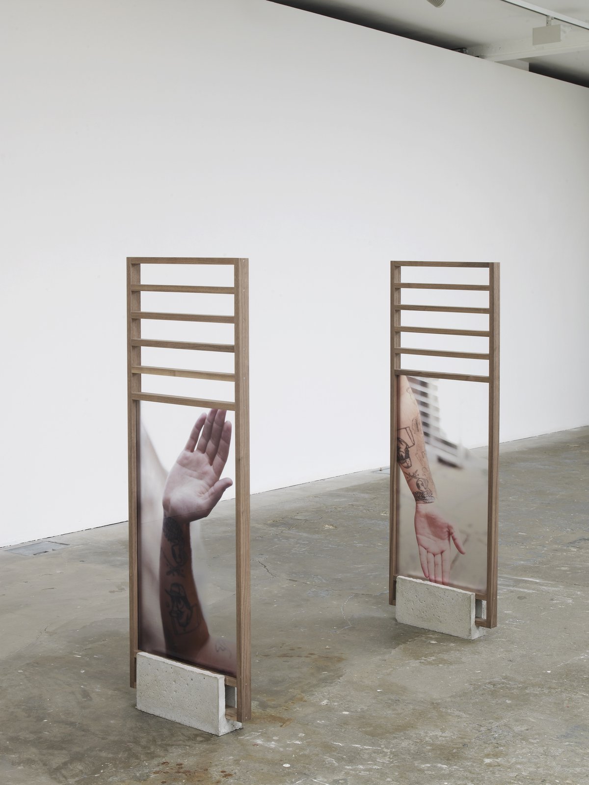 Philipp TimischlHigh 5 and Low 5 (recto), 2016Walnut frame, cement plinth, engraved metal label, UV-print on acrylic glass140 x 46 x 9 cm