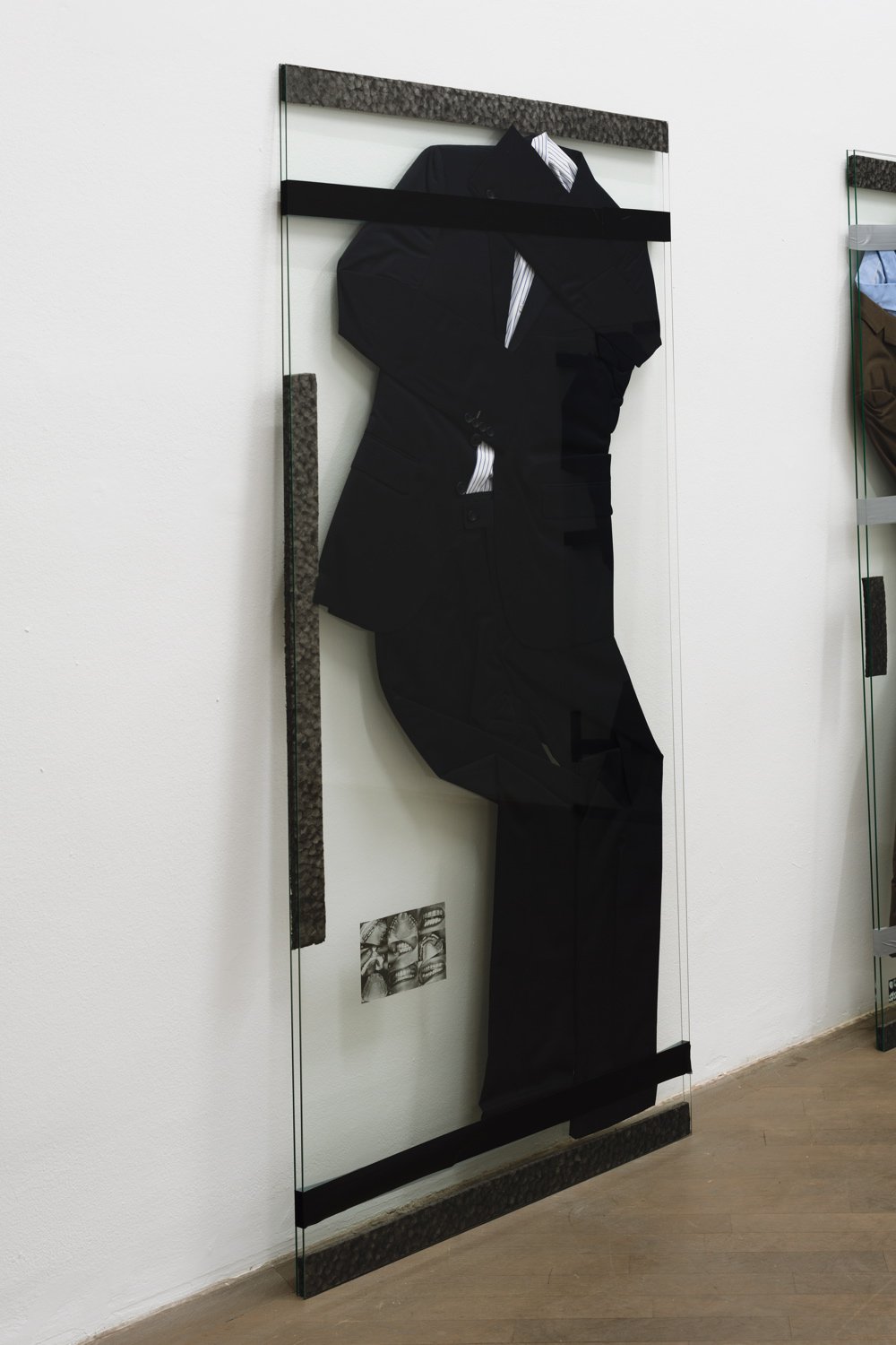 Lili Reynaud-DewarLive Through That?!, 2014Suit, shirt, foam, cut out photograph, duct tape and glass165 x 75 x 2.5 cm