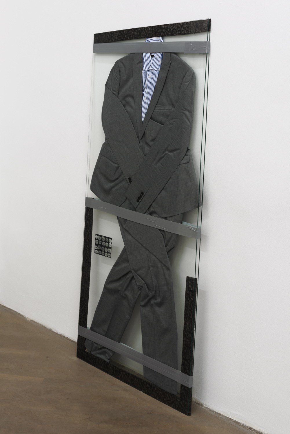 Lili Reynaud-DewarLive Through That?!Suit, shirt, foam, cut out photograph, duct tape and glass165 x 75 x 2.5 cm
